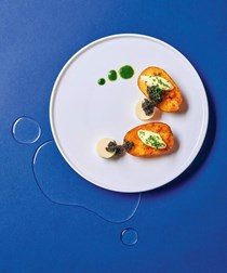 Caviar with duck fat potatoes, horseradish panna cotta & wild rocket sauce