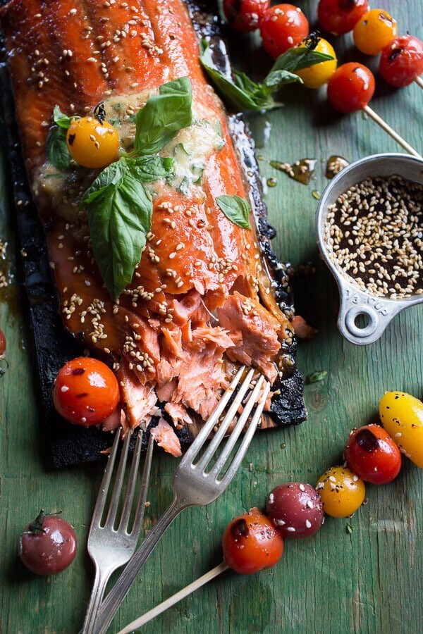 Cedar plank grilled sesame salmon with kimchi miso butter and grilled tomatoes