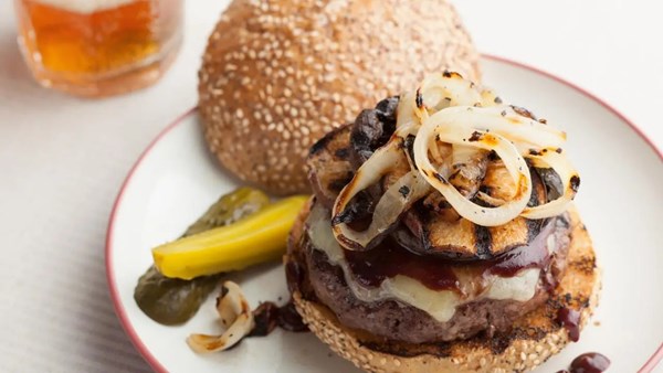 Cedar-planked burger with red wine barbecue sauce, cheddar cheese, sautéed mushrooms