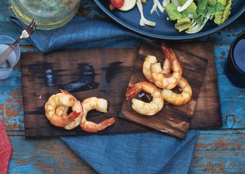 Cedar-planked shrimp with chipotle-pumpkin seed salsa