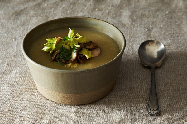 Celeriac and potato soup with mushroom, walnut, and celery leaf salad