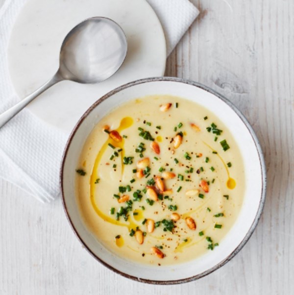 Celeriac and roasted garlic soup with chives and pine nuts 