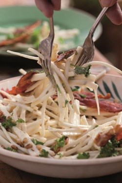 Celeriac salad with apple, pine nuts and prosciutto