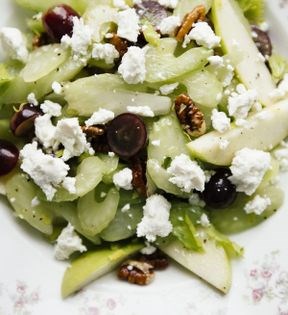 Celery stalk salad with grapes, apples, goat cheese, and pecans
