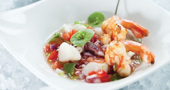 Ceviche with chile peppers and popcorn, sprinkled with nutritional yeast