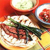 Char-grilled beef tortillas with guacamole and salsa cruda 