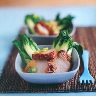 Char siu pork on steamed pak choy with sweet orange sauce