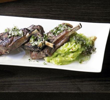 Charcoal-grilled lamb cutlet, broad bean and chilli mash and warm garlic and mint dressing