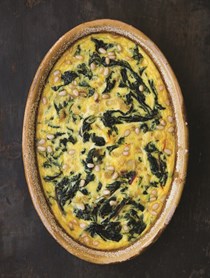 Chard and saffron flan in an almond crust with spring greens