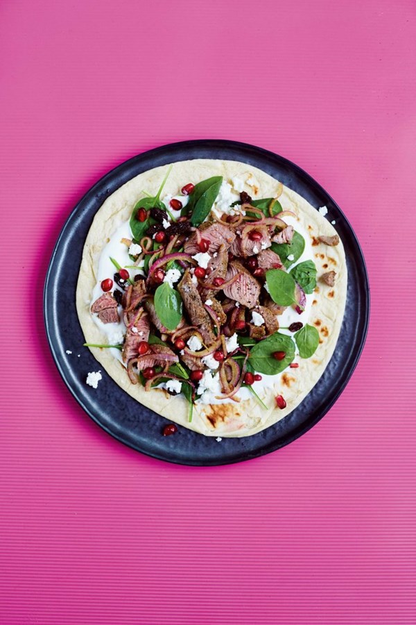 Chargrilled lamb on flatbreads with pine nuts, raisins & goat's cheese