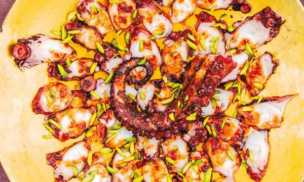 Chargrilled octopus with maple chilli dressing and pistachios