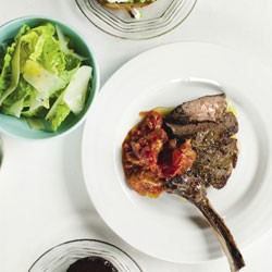 Chargrilled rib-eye with vine tomato ragu and baby gem salad