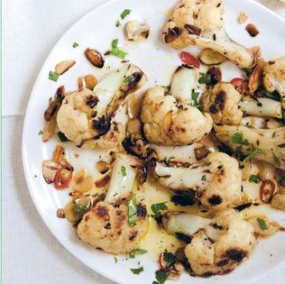 Charred baby cauliflower with cumin, chilli and almonds