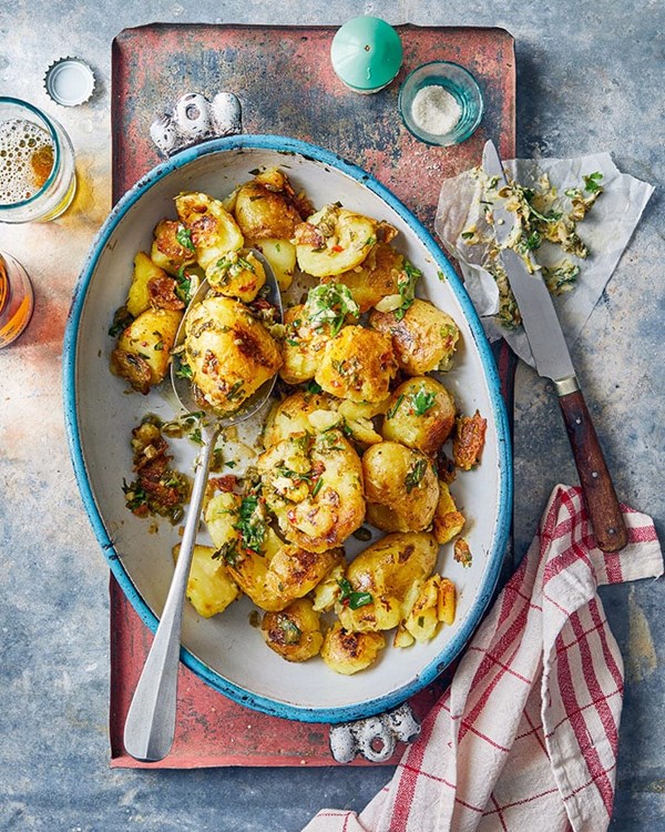 Charred baby new potatoes with chilli butter and herbs