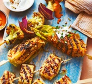 Charred cabbage skewers with harissa butter