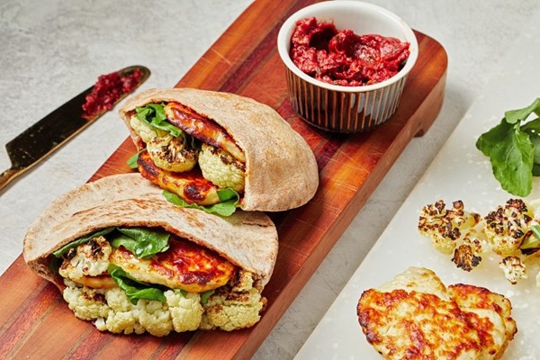 Charred cauliflower and halloumi pitas with harissa