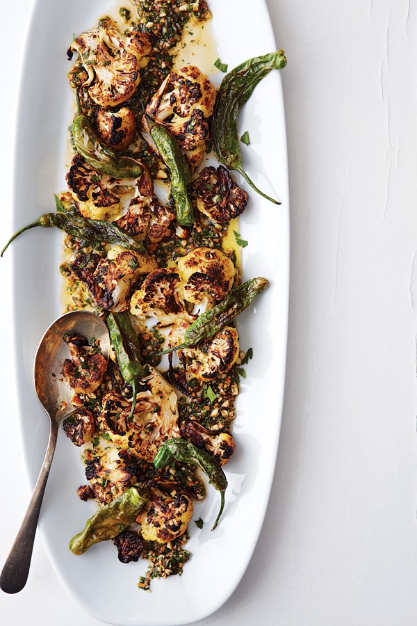 Charred cauliflower and shishito peppers with picada sauce