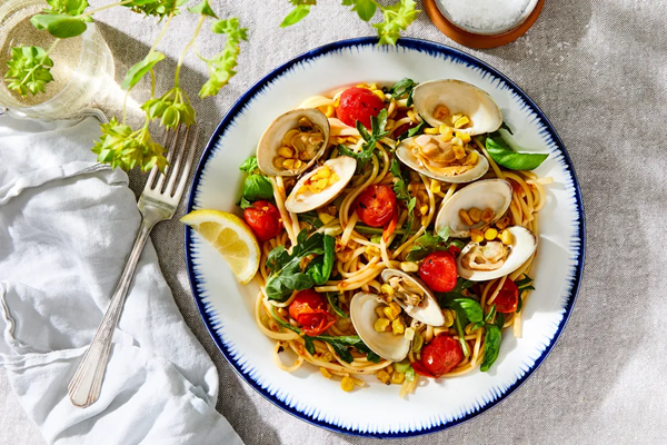 Charred corn & clam pasta with tomatoes