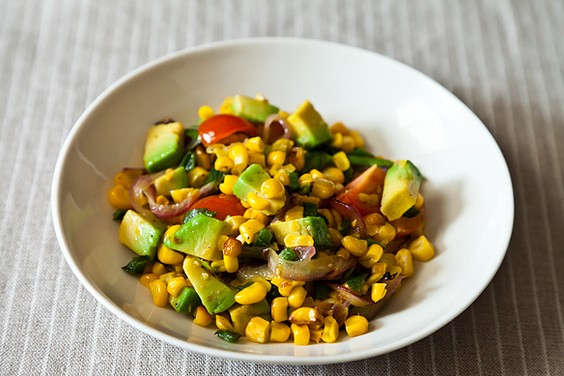 Charred corn and avocado salad with lime, chili and tomato