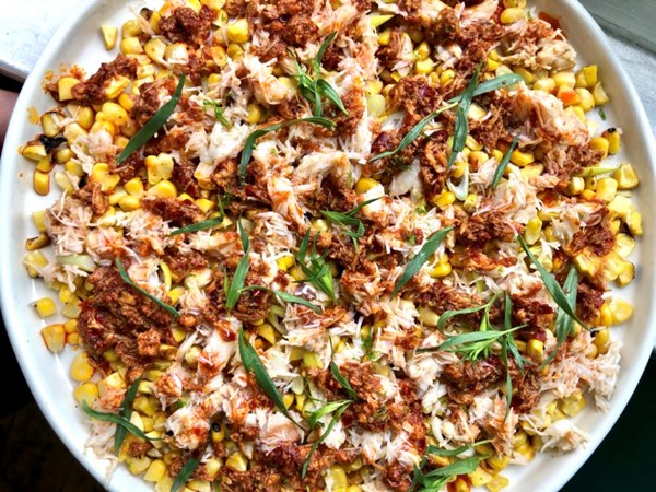 Charred corn and crab with harissa butter