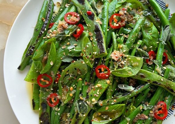 Charred green beans with anchovy dressing and seed dukkah