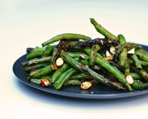 Charred green beans with harissa and almonds