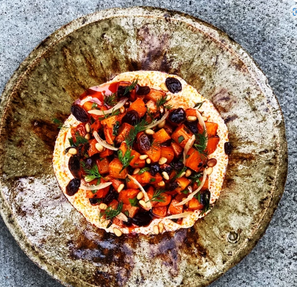 Charred Moroccan carrot salad with harissa crème fraîche & saffron-candied sultanas