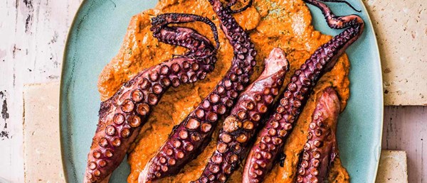 Charred octopus with chilli and lime and romesco sauce