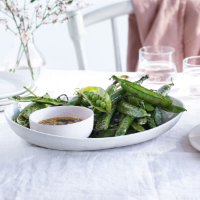 Charred peas in the pod with soy dipping sauce