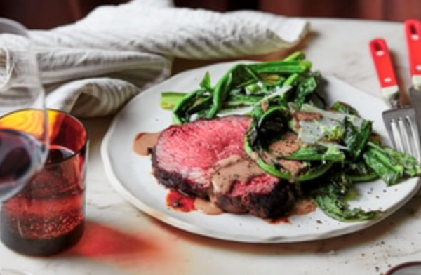 Charred porcini Scotch fillet with bitter greens and black garlic bagna cauda