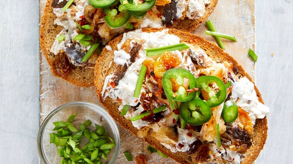 Charred sardine toasts with pickled golden raisins [Erica Collins]