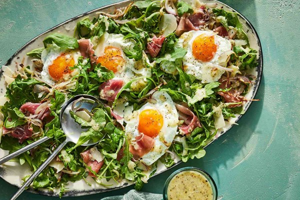 Charred shallot and arugula salad with sunny-side up eggs