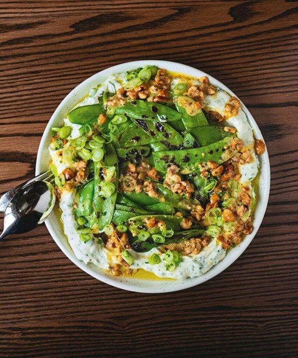 Charred snap peas with hazelnut dressing & lukmira [Casey McDonald]