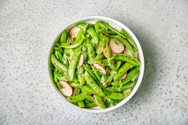 Charred snap peas with radishes, mint and lemon