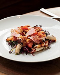 Charred squid salad with mustard greens and roasted-garlic dressing