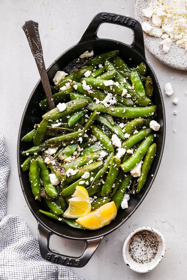 Charred sugar snap peas with lemon and feta cheese