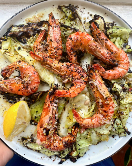 Charred sweetheart cabbage with prawns and a pickle brine dressing