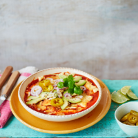 Charred tomato and chipotle chilaquiles with avocado