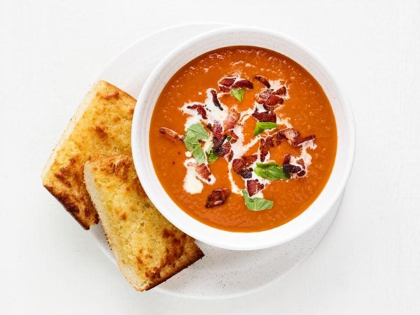 Charred tomato soup with cheesy garlic bread