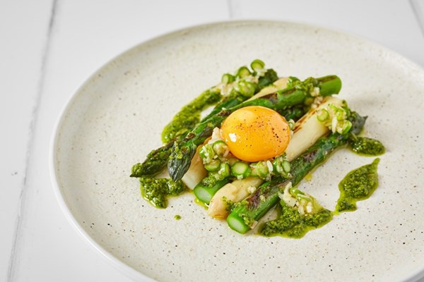 Charred white and green asparagus with pickled egg yolk and pesto