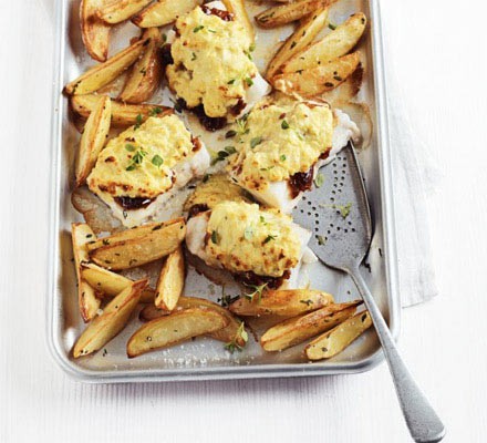 Cheese & onion rarebit-topped pollack with potato wedges