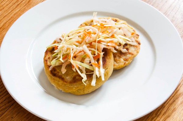 Cheese and bean pupusas (Salvadoran stuffed, griddled tortillas) with cabbage slaw