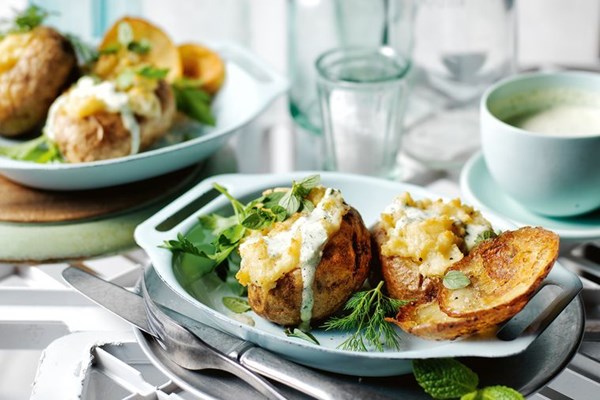 Cheese and garlic baked potatoes with green goddess dressing