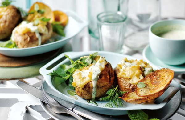 Cheese and garlic baked potatoes with green goddess dressing