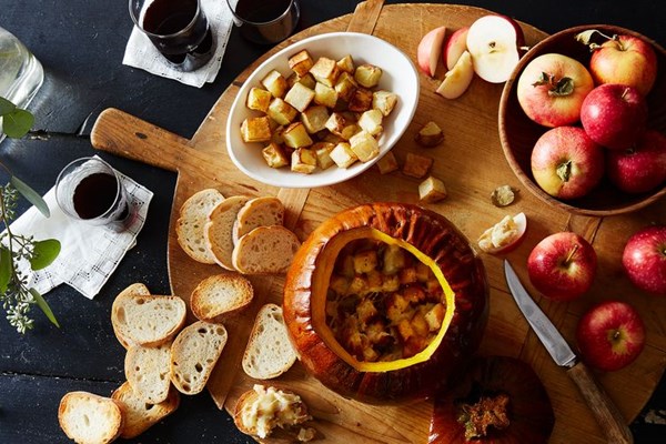 Cheese fondue stuffed roasted pumpkin