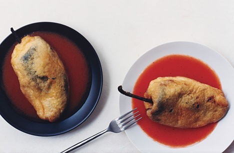 Cheese-stuffed poblanos with tomato sauce (Chiles rellenos de queso)