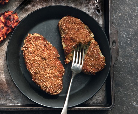 Cheese-stuffed potatoes with yogurt-spice paste and sesame seed crust