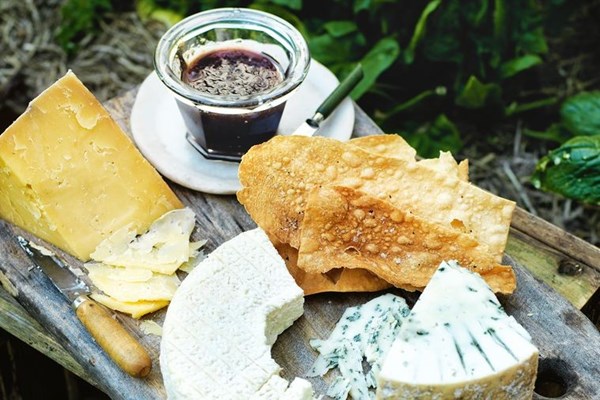 Cheeseboard with homemade lavosh and plum jam