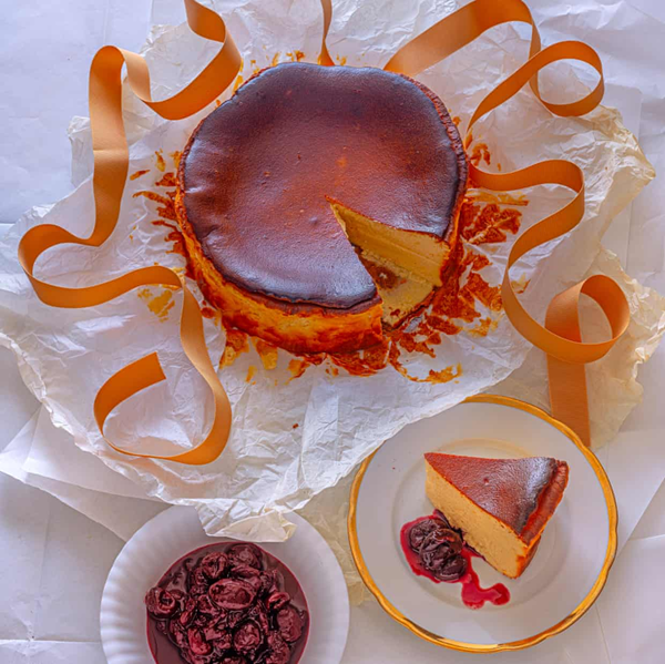 Cheesecake with mulled wine cherry compote