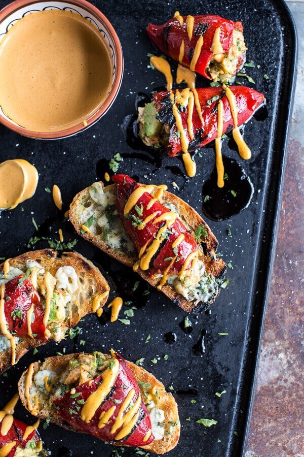 Cheesy avocado crab stuffed piquillo pepper ciabatta pizzettes with Sriracha aioli